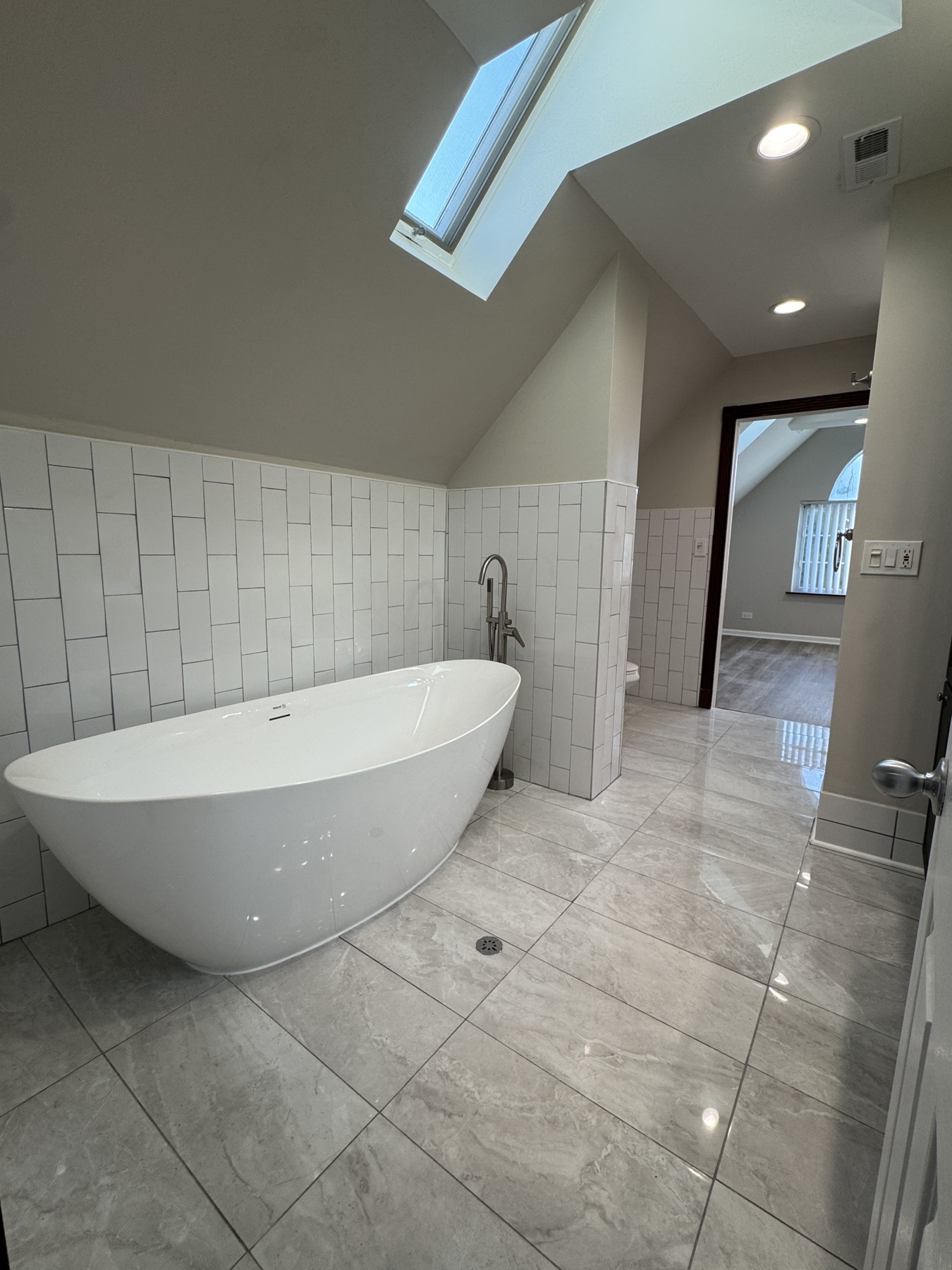 Natural light, all day — Skylight Spa Suite by Alpha Handyworks